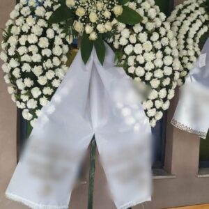 Big Funeral wreath on tripod.